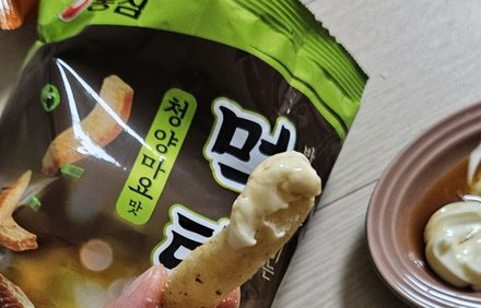 A Korean snack stick dipped in mayonnaise