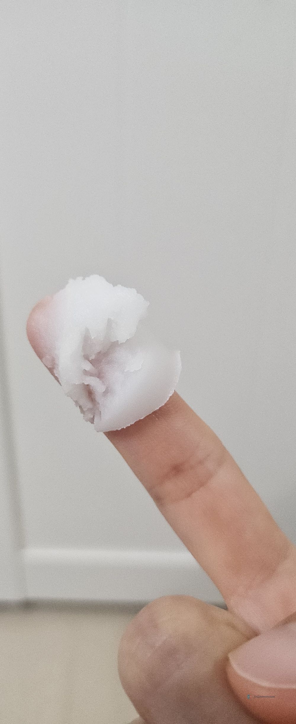 Banila Co Clean It Zero balm texture scooped onto fingertips