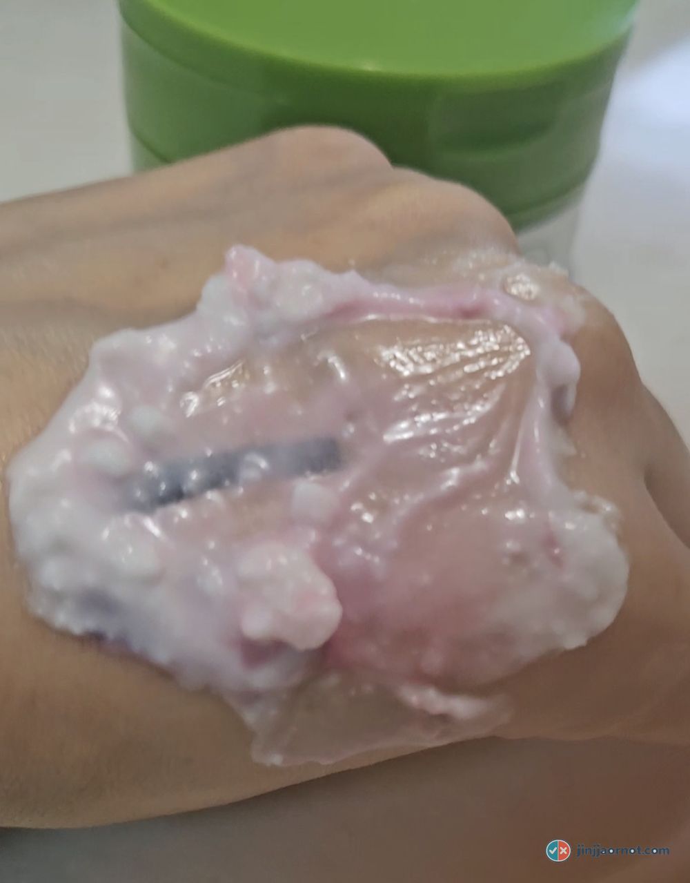The balm emulsified into a pink milky layer as it lifts the tint