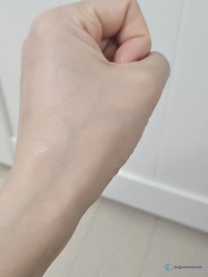 Round Lab Birch Juice sunscreen swatched and rubbed in on my hand, showing no white cast