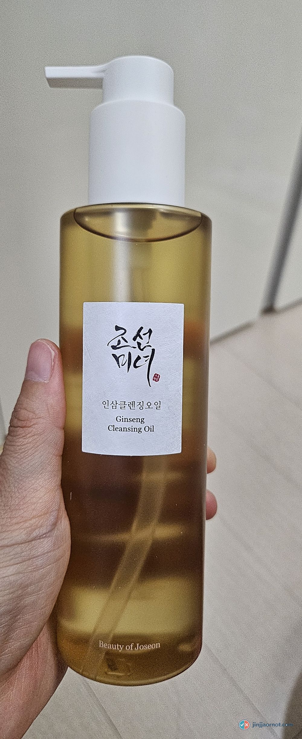 Beauty of Joseon Ginseng Cleansing Oil bottle, amber oil in a frosted bottle