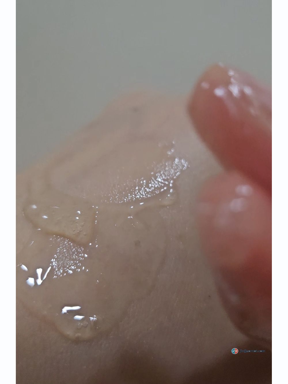 Beauty of Joseon Glow Serum spread across the back of a hand
