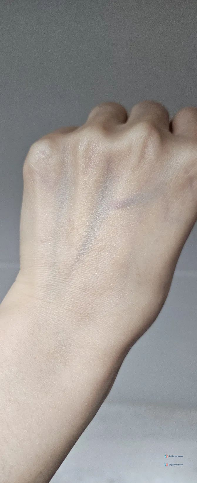 A swatch of Dr.G Red Blemish cream on the back of a hand before rubbing in