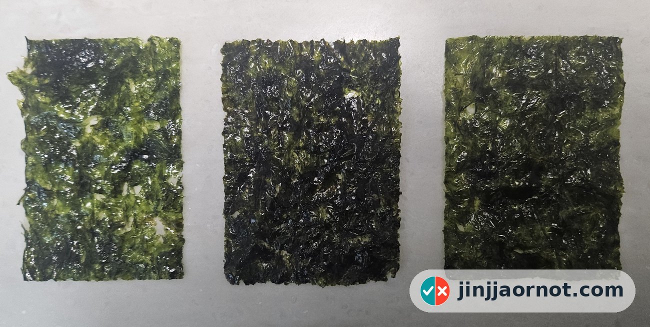 Three sheets of Korean seasoned seaweed laid flat side by side, showing color and texture differences