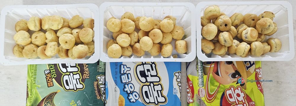 Three trays of Home Run Ball side by side: Dubai-style pistachio and caramel, salted milk, and original chocolate, with their Korean bags below