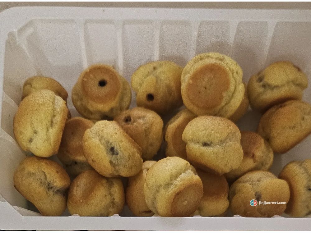 A tray of Haitai Home Run Ball chocolate puff snacks, straight out of the bag