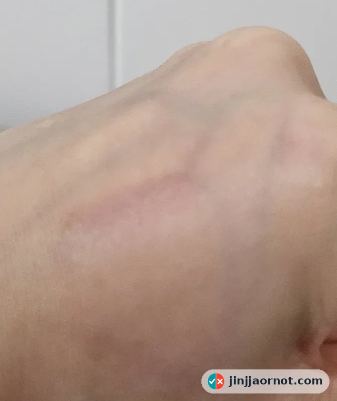 The same hand after one oil cleanse and a water-only rinse, with the swatches almost entirely gone