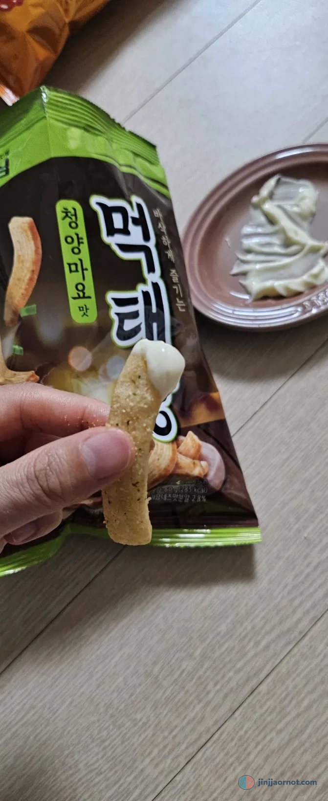 Looking down into an open bag of Mektaekkang chips, showing the seasoned ridged sticks