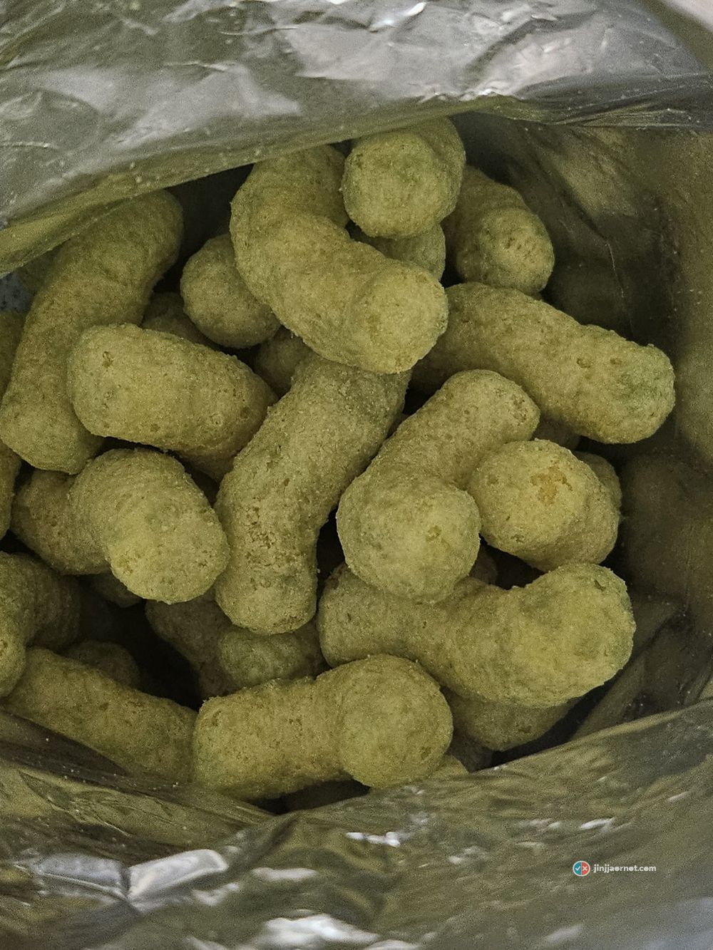 Melon Kick corn puffs inside the open bag