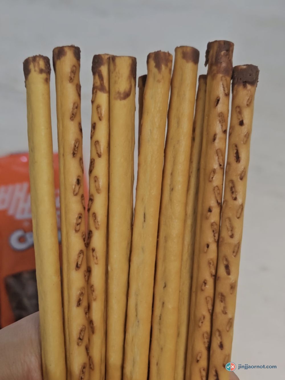 Nude Pepero sticks, bare biscuit on the outside with chocolate visible inside the ends