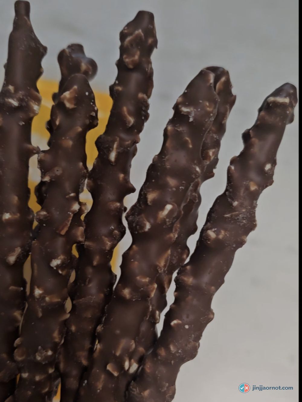 Crunky Pepero sticks close up, chocolate coating with crisped rice pieces set into it