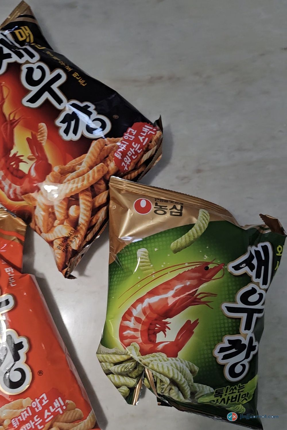Several flavors of Nongshim Shrimp Crackers laid out — Korea's number one selling snack